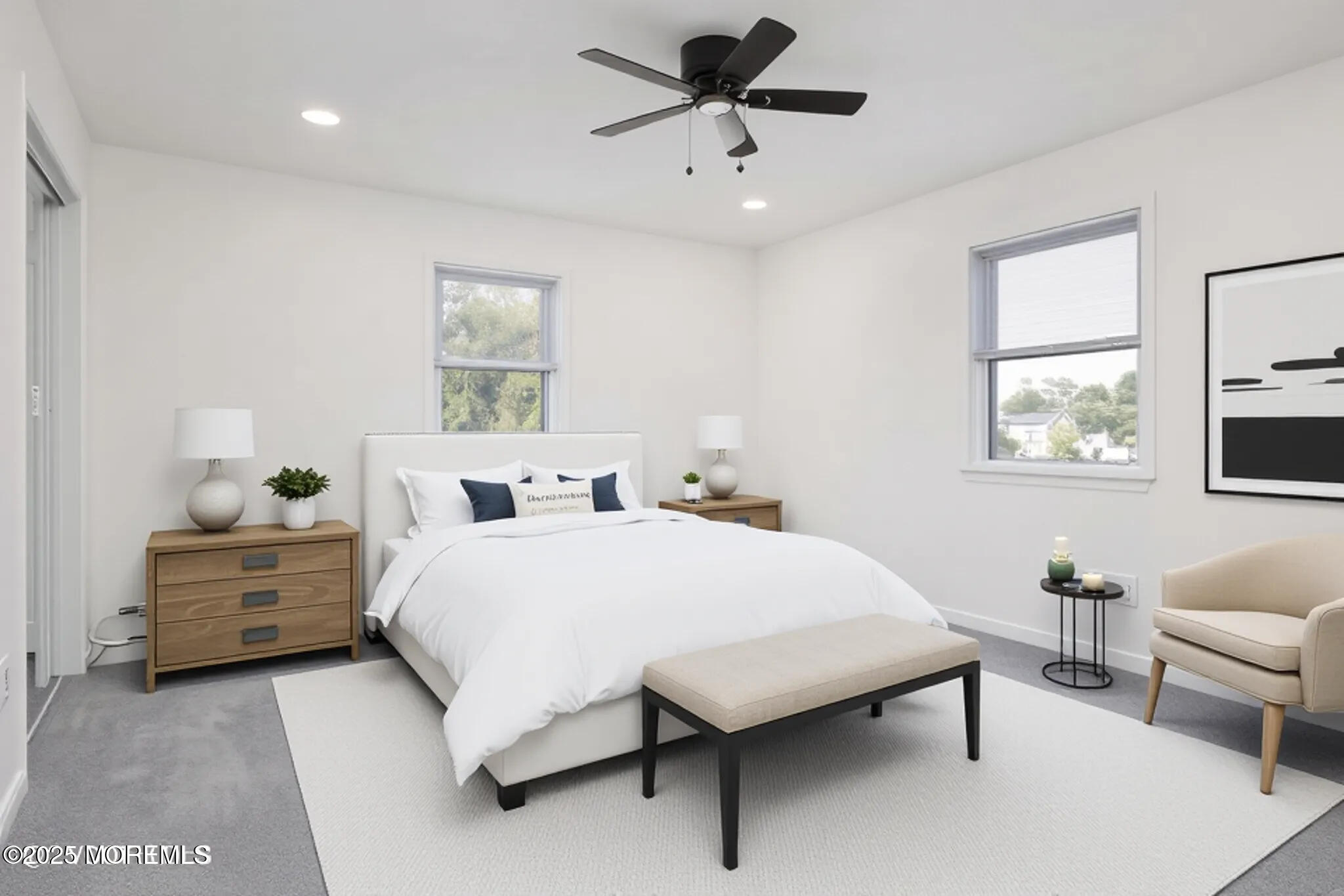 26 Windsor Terrace, Unit G Freehold, NJ 07728 - Photo 12 of 15 a large bedroom with a bed and a couch