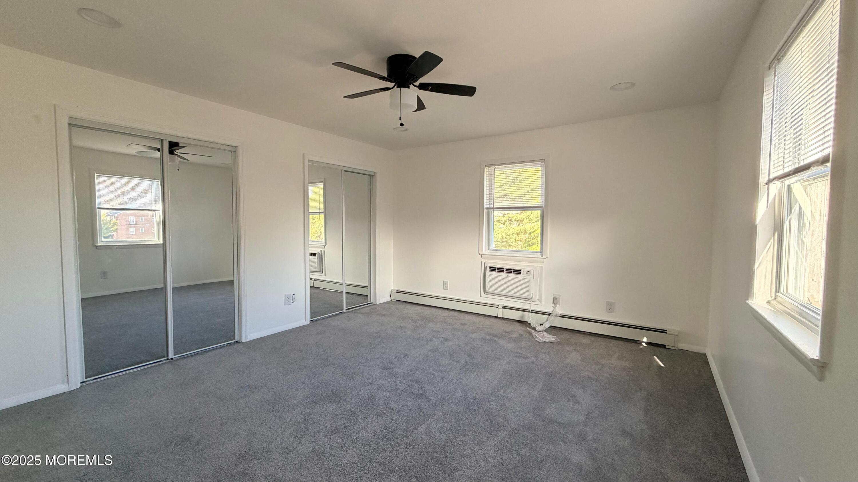 26 Windsor Terrace, Unit G Freehold, NJ 07728 - Photo 14 of 15 a view of an empty room with a window