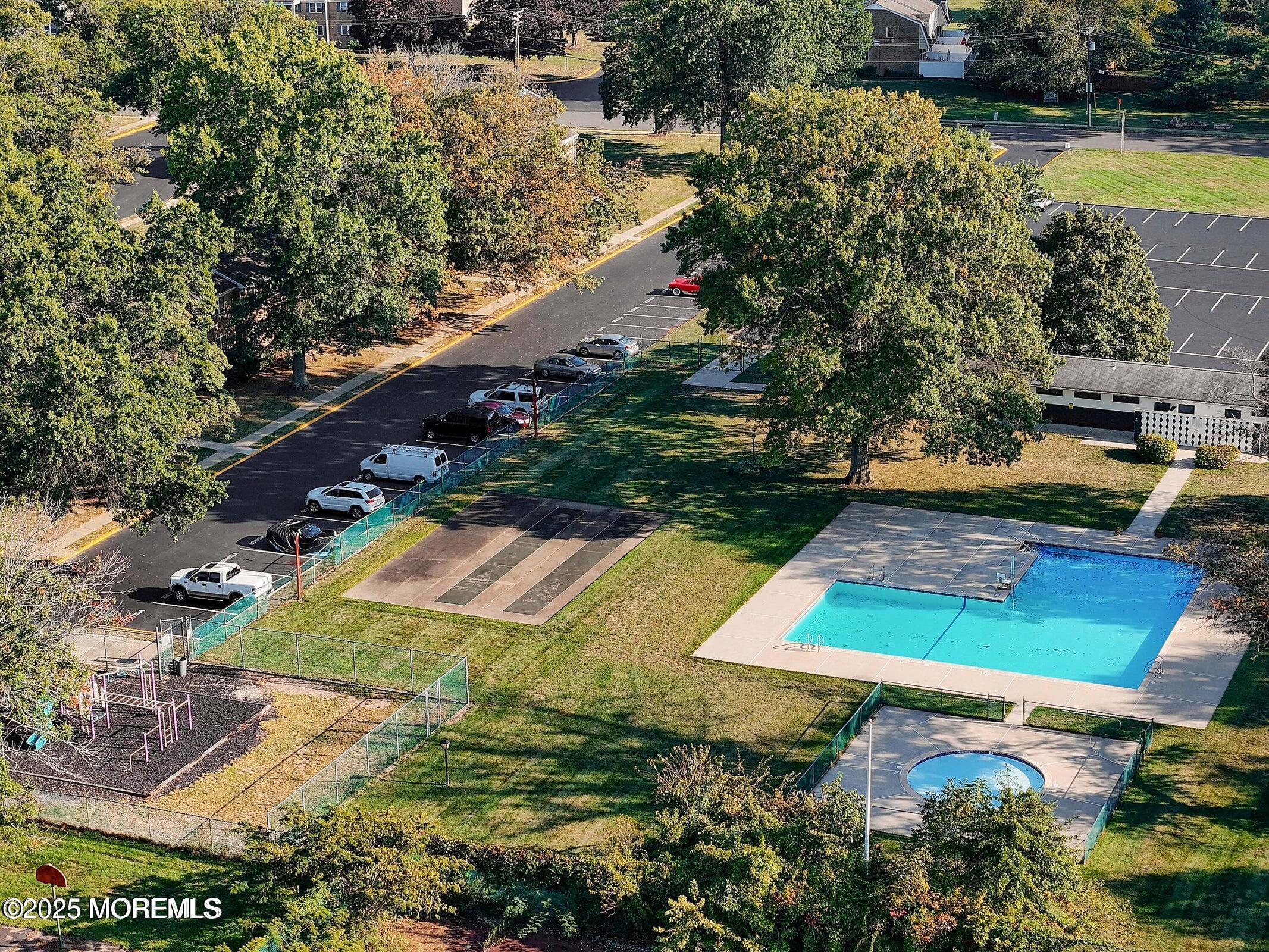 26 Windsor Terrace, Unit G Freehold, NJ 07728 - Photo 15 of 15 an aerial view of a house with a yard basket ball court and outdoor seating