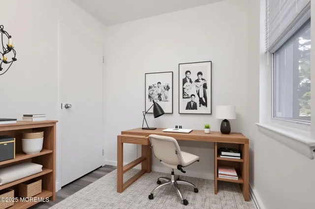 a view of a workspace with furniture