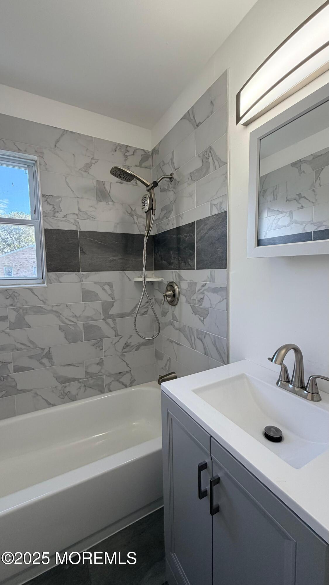 26 Windsor Terrace, Unit G Freehold, NJ 07728 - Photo 10 of 15 a bathroom with a sink and a bathtub