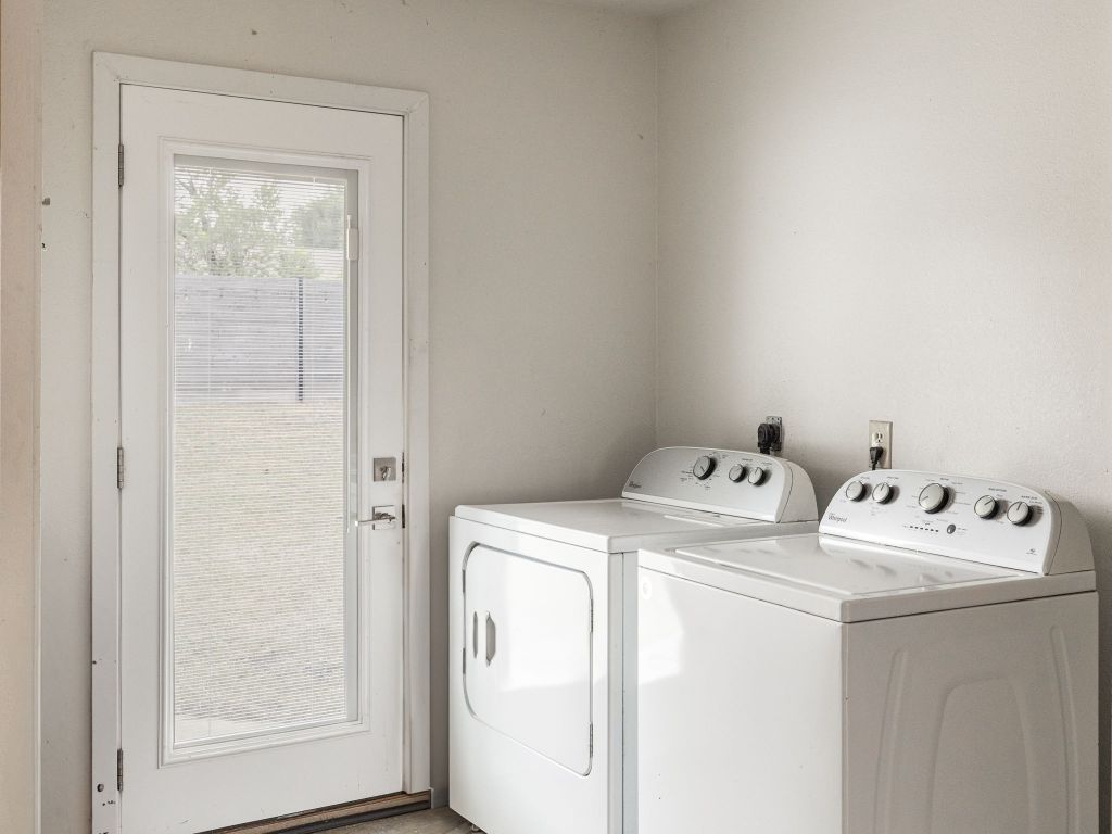 9506 Mountain Quail Road Austin, TX 78758 - Photo 12 of 16 Independent, generous washer-dryer area in garage. Door leads to the backyard.
