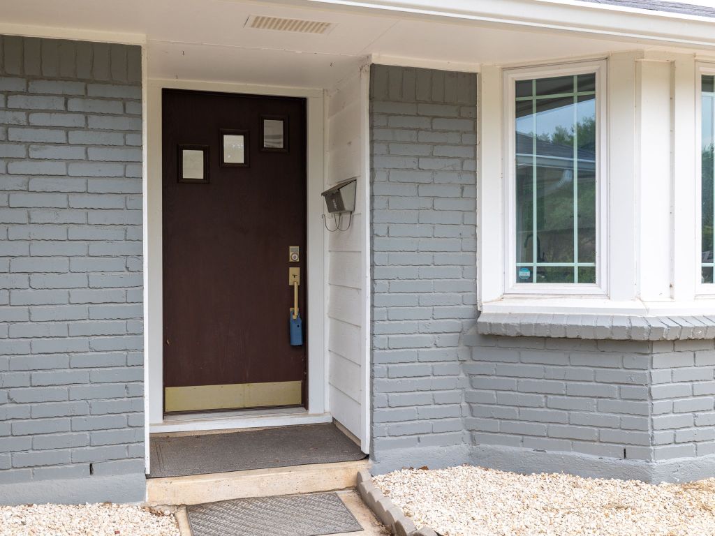 9506 Mountain Quail Road Austin, TX 78758 - Photo 2 of 16 A beautifully painted brick facade welcomes you home.