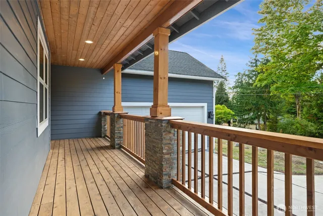 a view of balcony with wooden floor