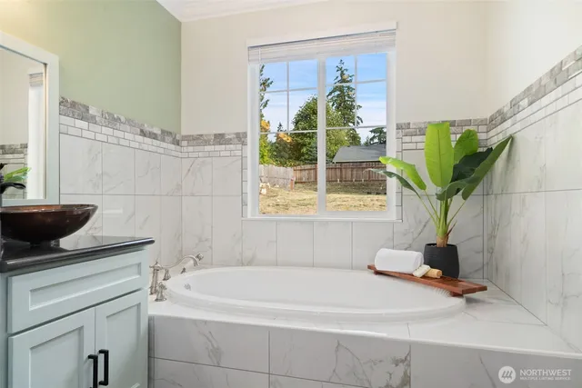 a bathroom with a bathtub and a sink