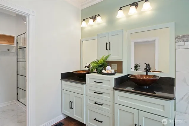 a bathroom with a sink and a mirror