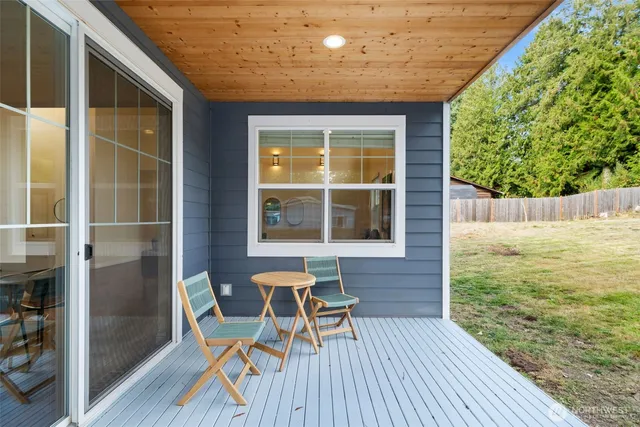a balcony view with a seating space