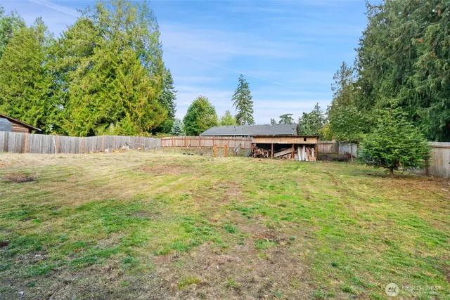 a view of a swimming pool with a yard