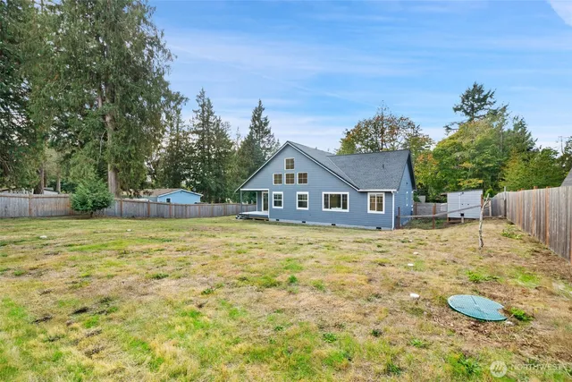 a house with trees in the background