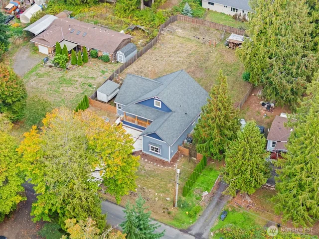 an aerial view of a house with a yard and garden