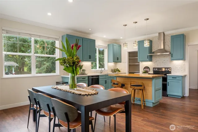 a kitchen with a table and chairs in it