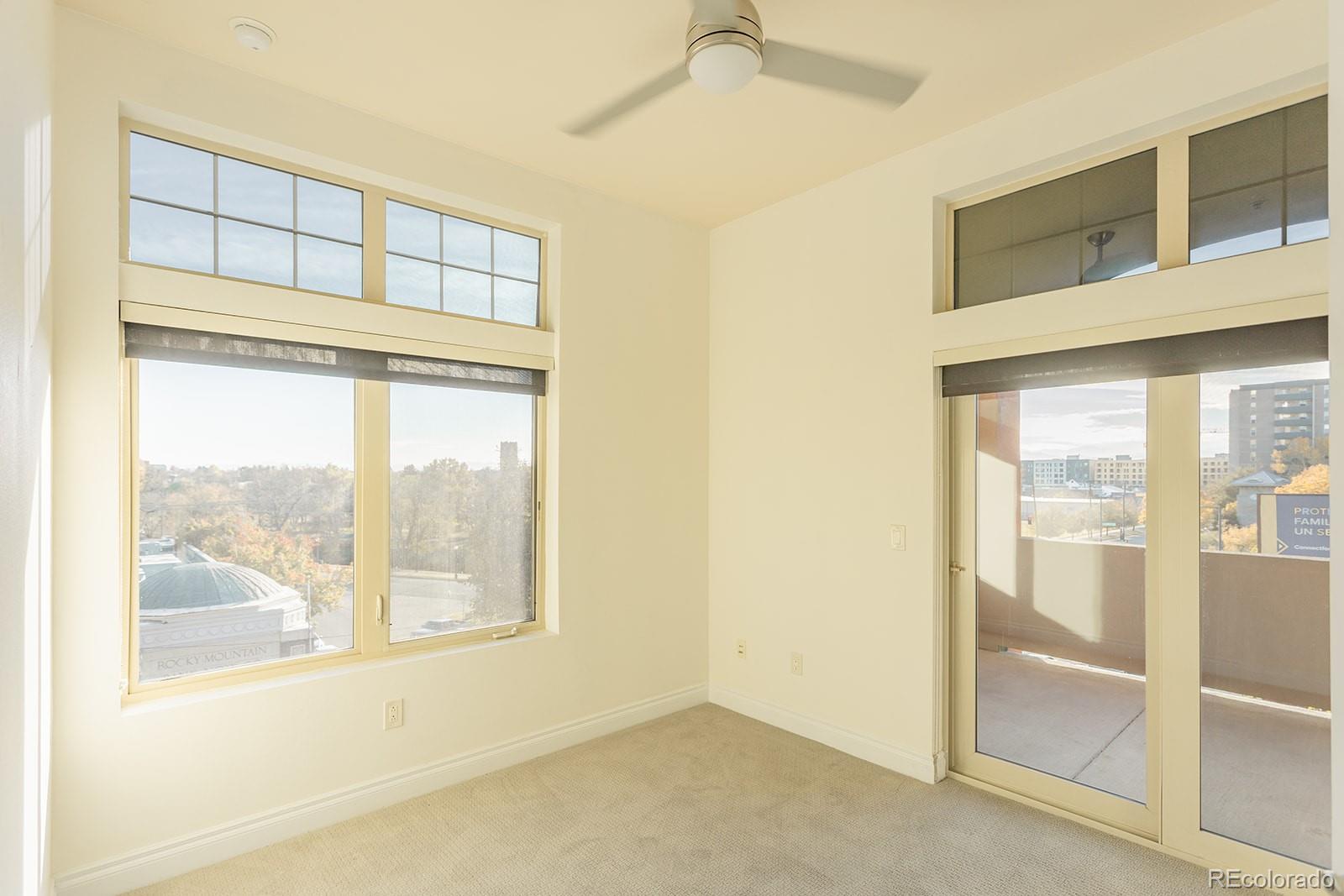 1120 Deleware, Unit 504 Denver, CO 80204 - Photo 11 of 29 a view of an empty room with a window