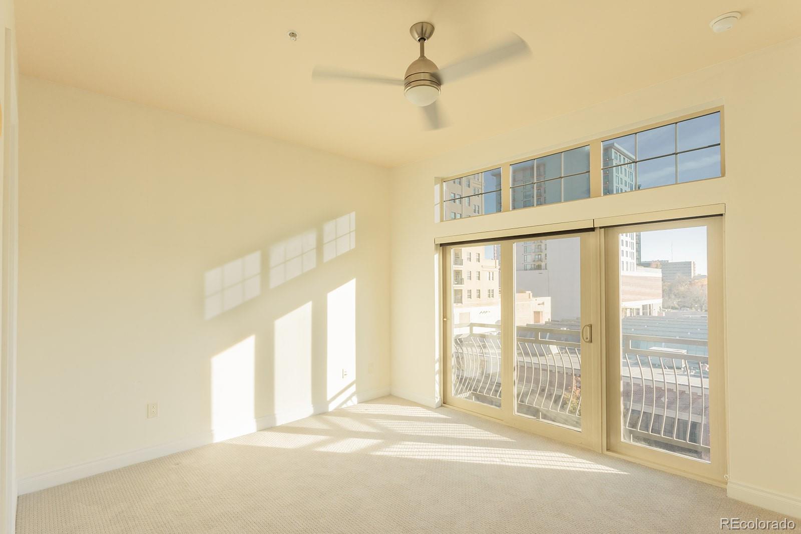 1120 Deleware, Unit 504 Denver, CO 80204 - Photo 14 of 29 a view of an empty room with a window