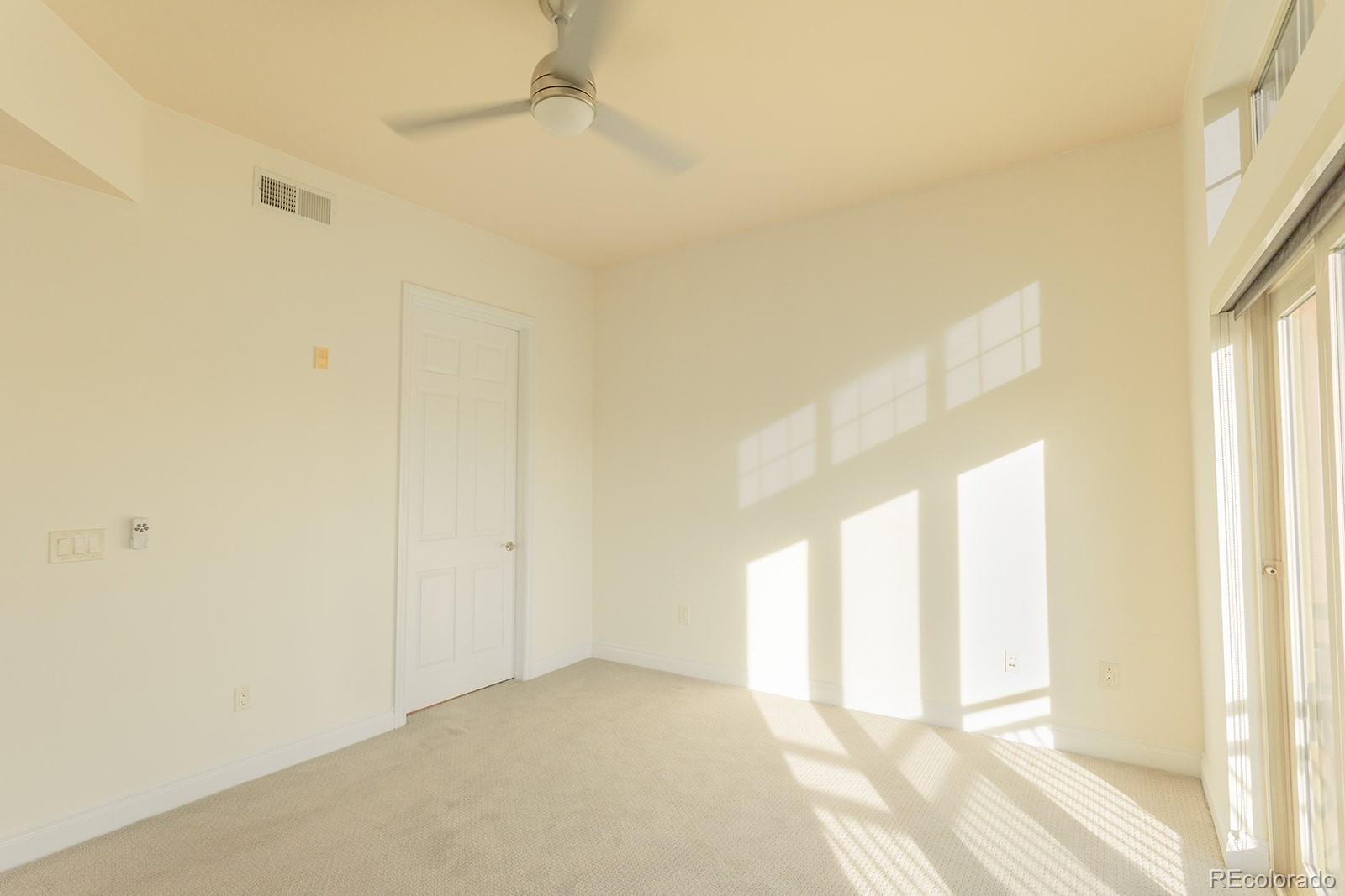 1120 Deleware, Unit 504 Denver, CO 80204 - Photo 15 of 29 a view of an empty room and a window