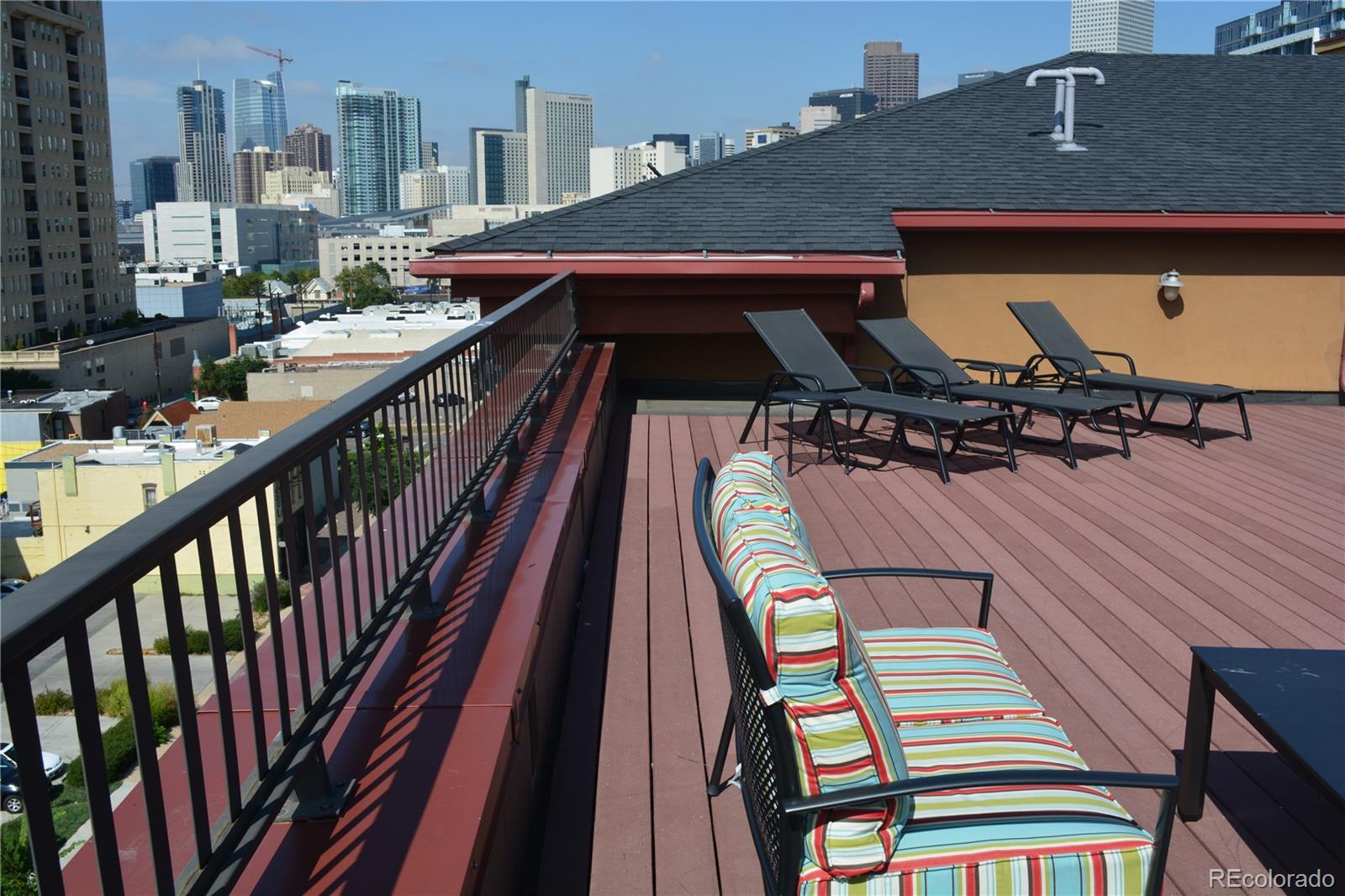 1120 Deleware, Unit 504 Denver, CO 80204 - Photo 28 of 29 a view of a patio with tables and chairs