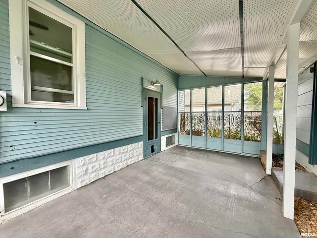 a view of an empty room with a balcony