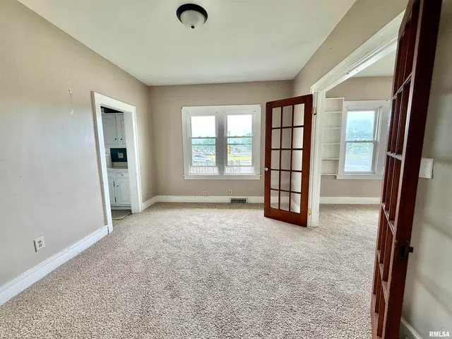 an empty room with windows