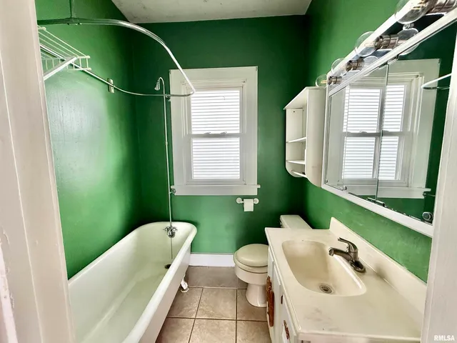 a bathroom with sink and mirror