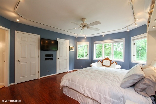 1119 Deerpass Road Marengo, IL 60152 - Photo 22 of 39 a bedroom with a bed and a large window