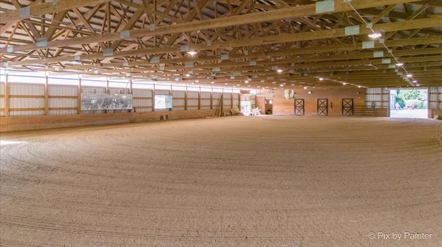 a view of a garage with a bike and a car