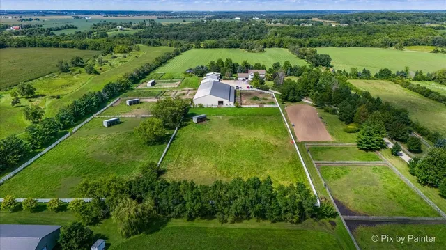 a view of a city with lush green forest