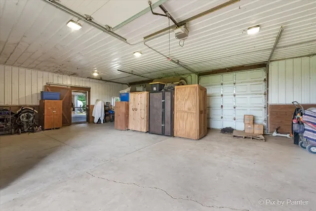 a view of a patio with chairs and table in patio