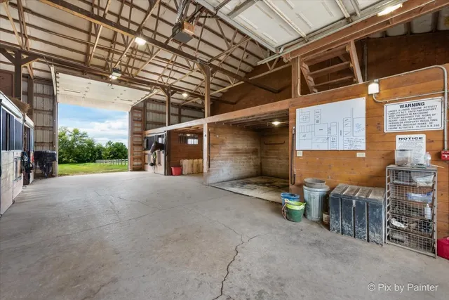 a front view of a house with swimming pool having outdoor seating