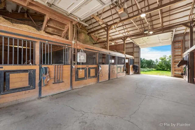 a view of entryway livingroom and hall with wooden floor