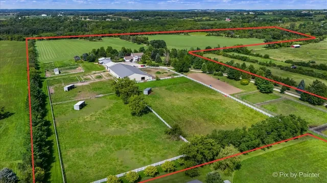 a view of a lush green hillside and houses