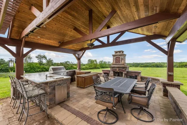 a bathroom with a granite countertop sink vanity and mirror