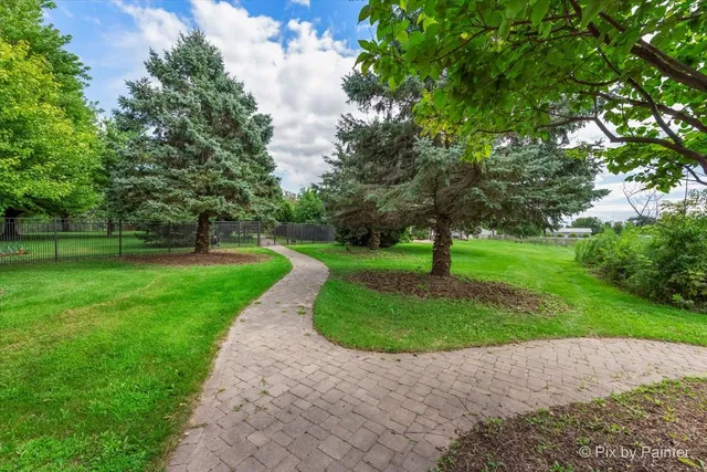 a bedroom with a large bed and a flat tv screen