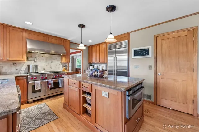 a living room with furniture a rug and a large window