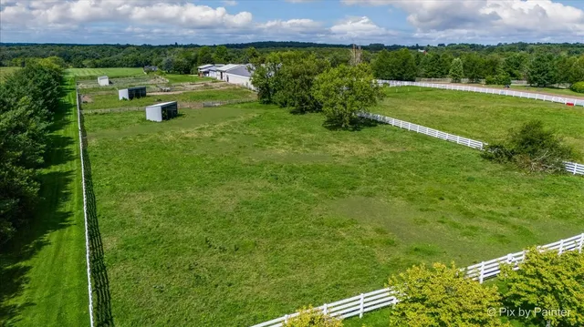 aerial view of a house with a yard