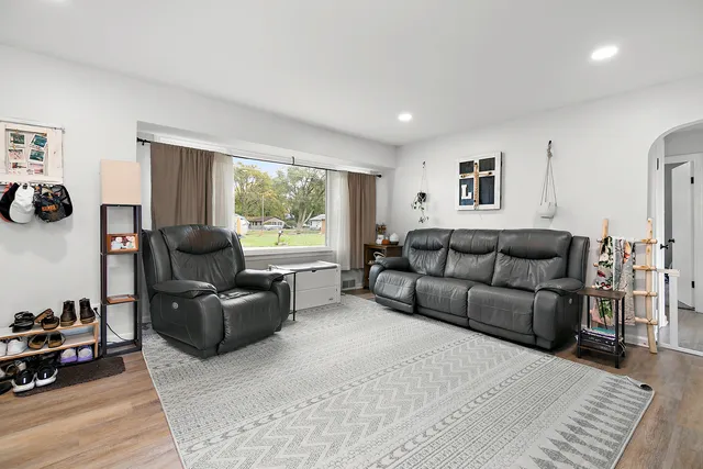 a living room with furniture and a window