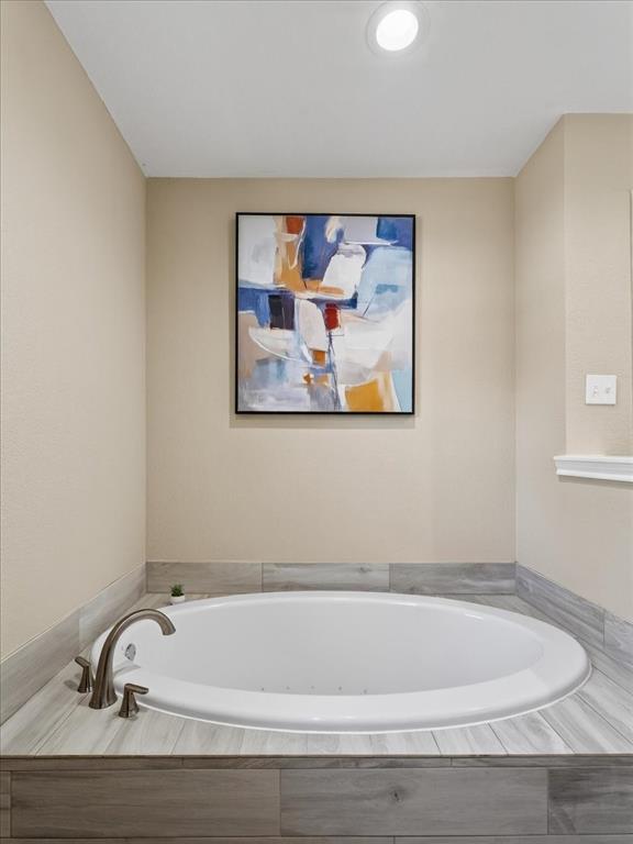 3863 Clayton Road East Fort Worth, TX 76116 - Photo 26 of 39 a bathroom with a tub and a window