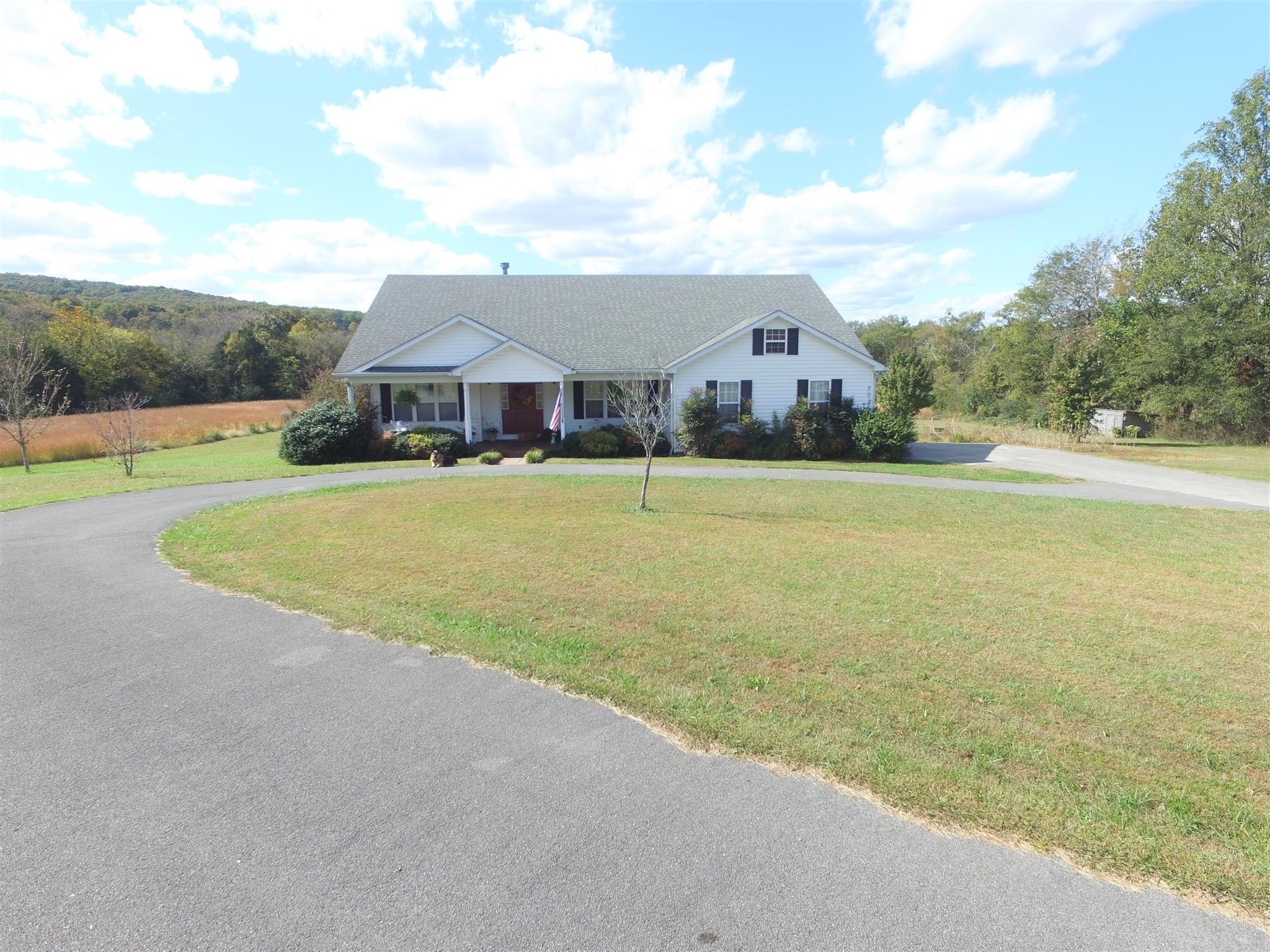 3950 Williams Cove Road Winchester, TN 37398 - Photo 1 of 1 a front view of a house with a yard and garage