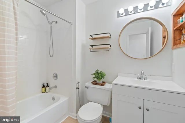 a bathroom with a sink a toilet and a bathtub