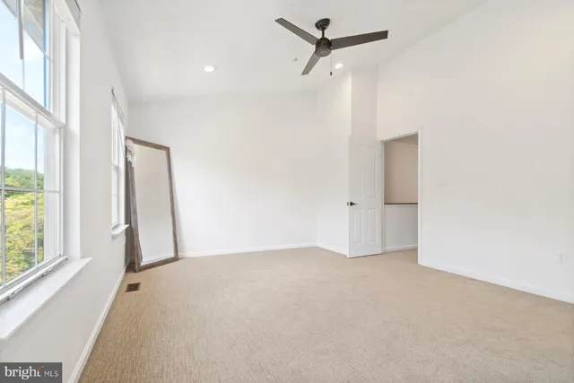 an empty room with a empty space and a window