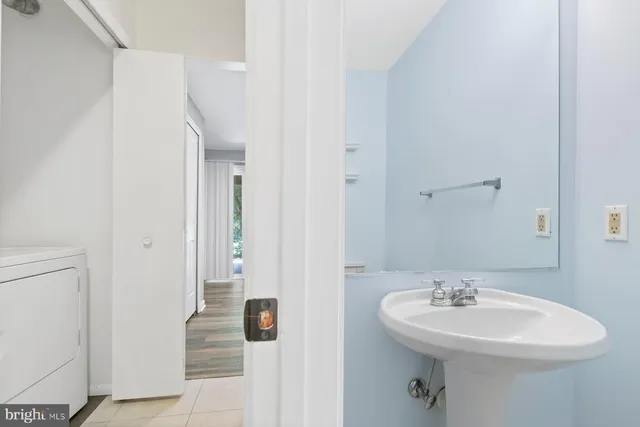 a bathroom with a sink and mirror