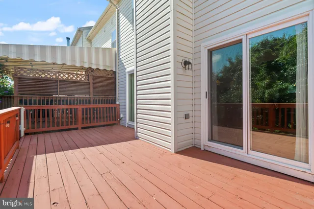 a view of a balcony with wooden floor