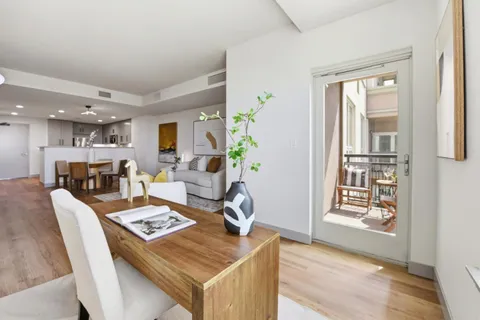 a view of a dining room with furniture and a table