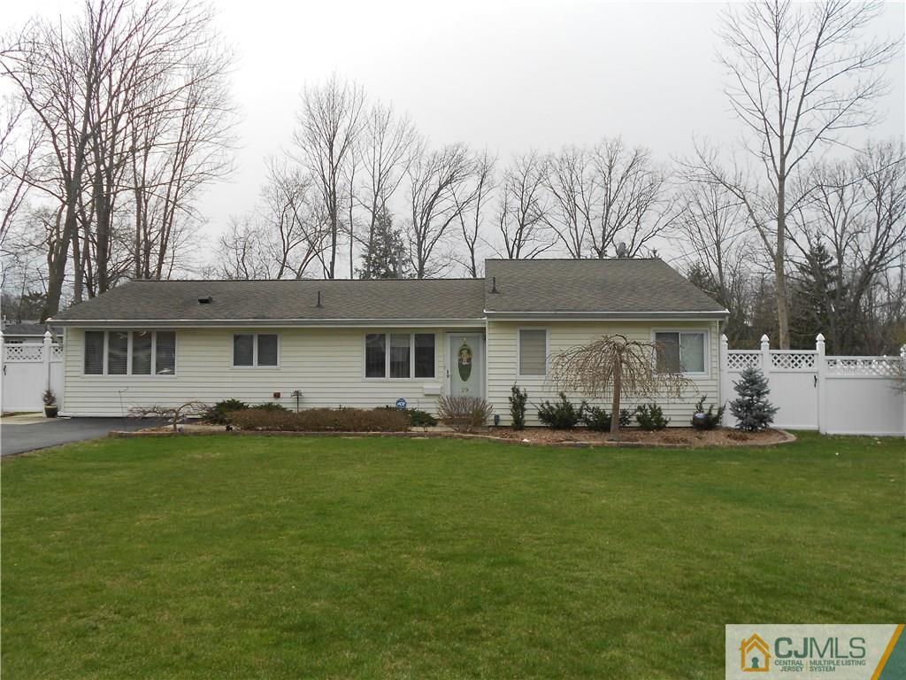 29 Kendall Road Kendall Park, NJ 08824 - Photo 1 of 22 a front view of a house with a yard