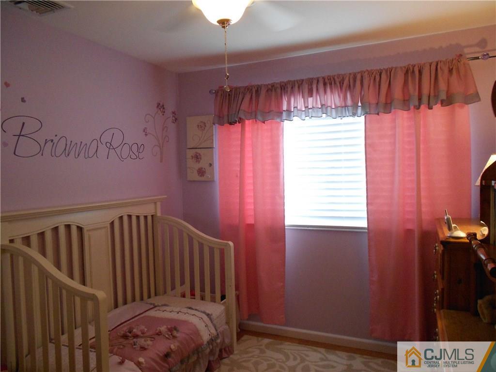 29 Kendall Road Kendall Park, NJ 08824 - Photo 10 of 22 a view of a hallway with a window
