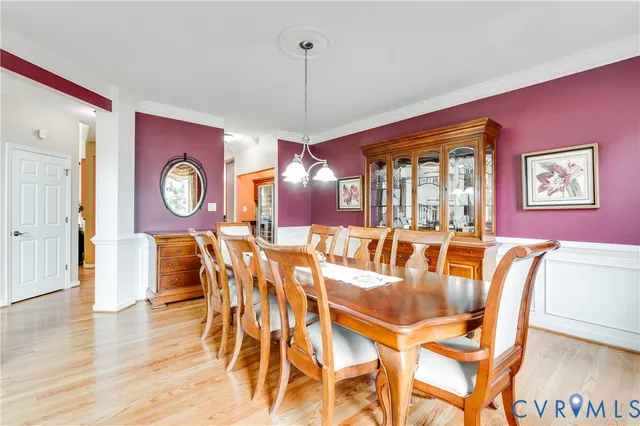 a living room with furniture and a book shelf
