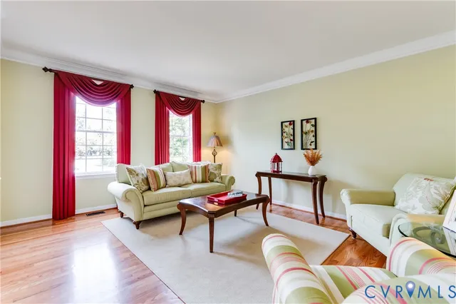 a kitchen with stainless steel appliances wooden floors and wooden cabinets