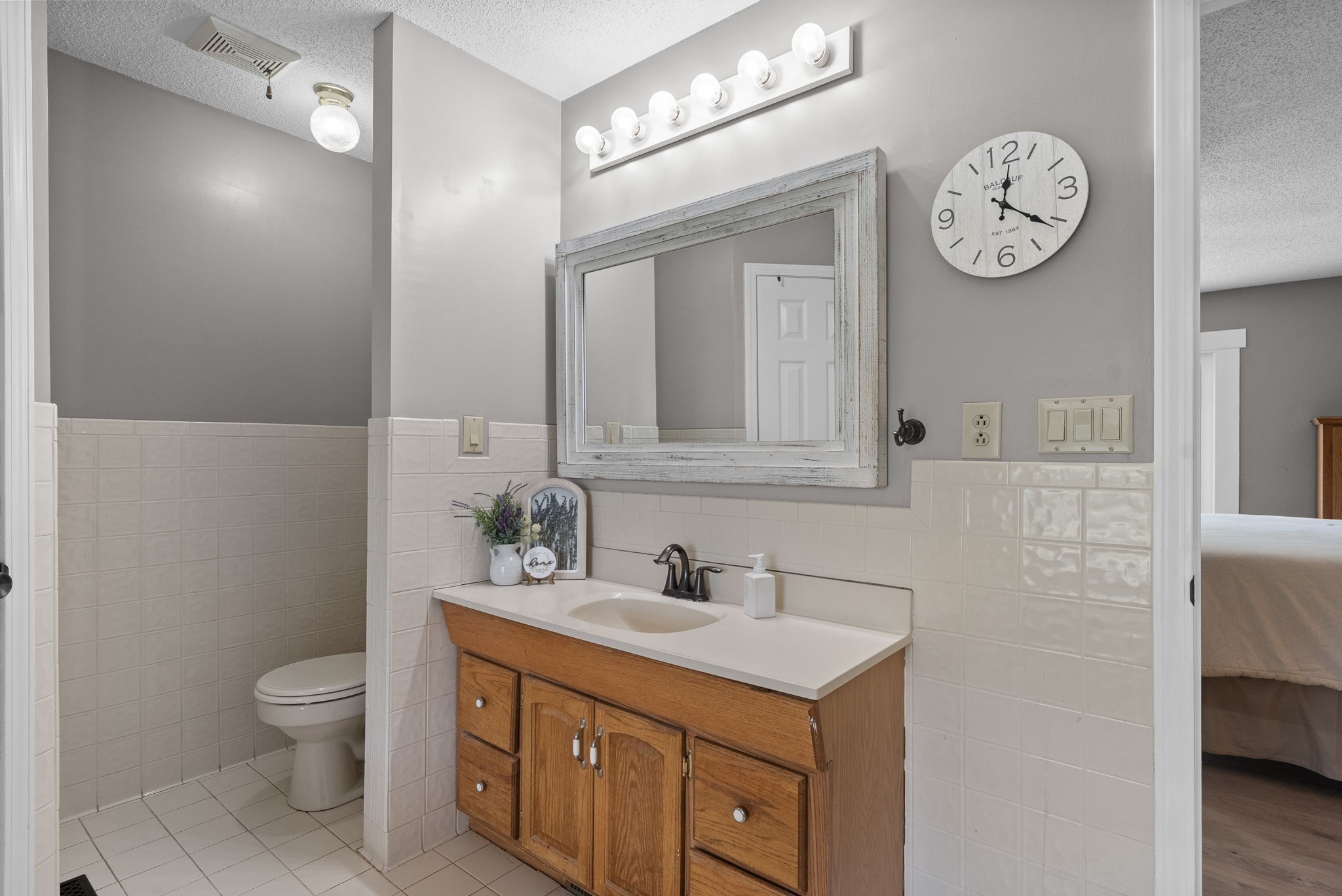 2430 Underwood Road Cunningham, TN 37052 - Photo 20 of 49 a bathroom with a toilet sink and mirror
