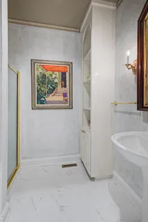 a bathroom with a bathtub and a sink