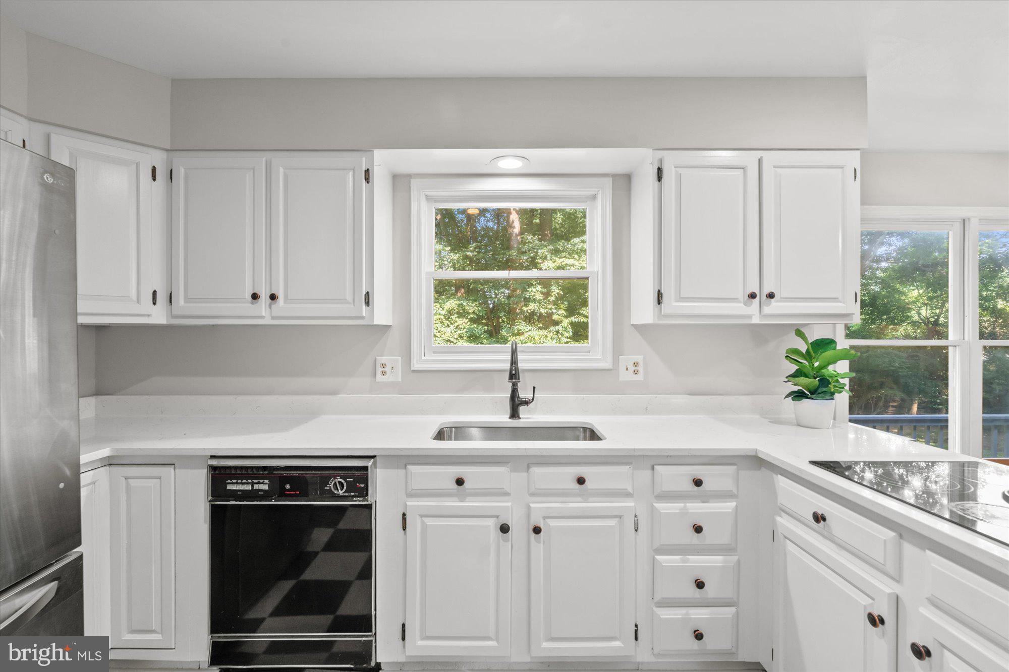 10100 Lawyers Road Vienna, VA 22181 - Photo 17 of 41 Quartz counters throughout kitchen
