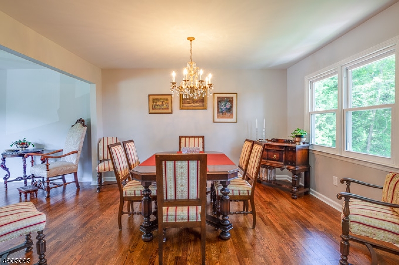 14 Ash Lane Randolph, NJ 07869 - Photo 9 of 22 a view of a dining room with furniture a chandelier and wooden floor