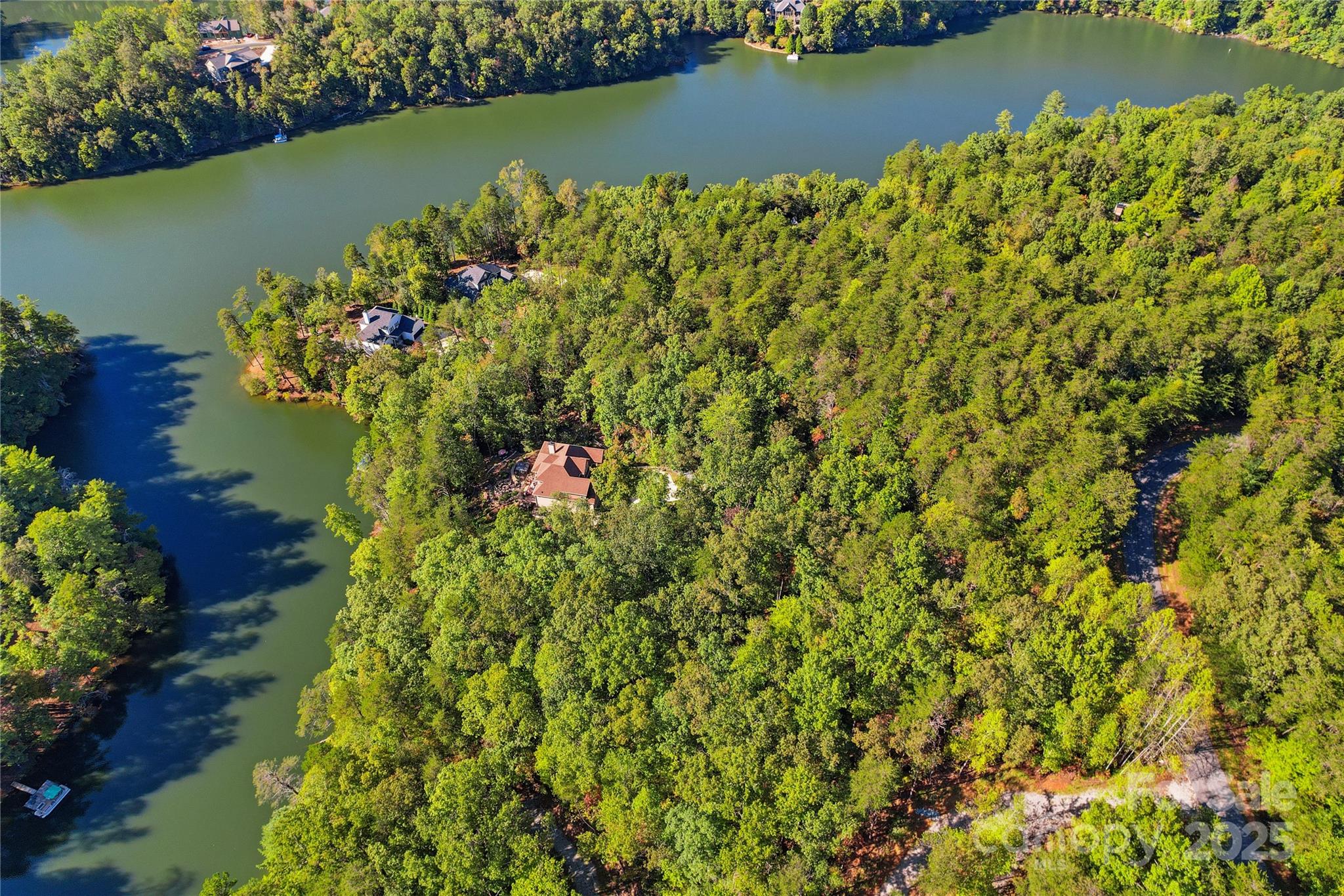 Lot 15 South Cove Rd Mill Spring, Unit 15 Mill Spring, NC 28756 - Photo 19 of 47 an aerial view of a houses with a lake view